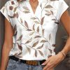 Explosive Summer French Fashion Leaf Print V-neck Loose Type Short-sleeved Temperament Commuter T-shirt Female Models